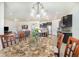 Open-concept dining area flows into a modern kitchen and cozy living space for easy entertaining at 4672 Marina Row Dr, Orlando, FL 32820