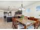 Stylish dining area that connects to the well-equipped kitchen with granite countertops at 4672 Marina Row Dr, Orlando, FL 32820