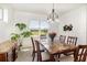 Serene dining room area featuring views of the backyard landscaping at 4672 Marina Row Dr, Orlando, FL 32820