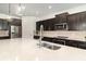 Close-up of modern kitchen with granite counters and backsplash with sleek stainless steel appliances at 4672 Marina Row Dr, Orlando, FL 32820