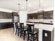 Modern kitchen with stainless steel appliances, stylish backsplash, and a large center island at 4672 Marina Row Dr, Orlando, FL 32820
