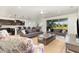 Spacious living area seamlessly connecting to a modern kitchen and backyard access, ideal for entertaining at 4672 Marina Row Dr, Orlando, FL 32820
