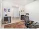 Office with desk, shelves, and patterned rug, and light grey wood-look floors at 4672 Marina Row Dr, Orlando, FL 32820