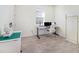 Bright office space featuring a modern desk setup with monitors, and light grey wood-look floors at 4672 Marina Row Dr, Orlando, FL 32820