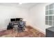 Office with a modern desk setup, patterned rug, and light grey wood-look floors at 4672 Marina Row Dr, Orlando, FL 32820