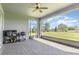 Screened-in patio with pavers, ceiling fan, and outdoor kitchen prep area perfect for entertaining at 4672 Marina Row Dr, Orlando, FL 32820