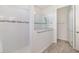 This bathroom features a glass shower with white tiled walls at 4672 Marina Row Dr, Orlando, FL 32820