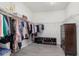 Spacious walk-in closet with custom shelving, storage and shoe racks at 4672 Marina Row Dr, Orlando, FL 32820