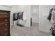 Spacious walk-in closet with custom shelving and clothes racks at 4672 Marina Row Dr, Orlando, FL 32820