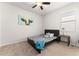 Bedroom featuring a full bed with an area rug, window, and side table at 475 Pitt St, Clermont, FL 34711