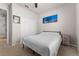 Bedroom with a bed, window, and closet doors at 475 Pitt St, Clermont, FL 34711
