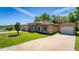 Single Gathering home with a three car garage, well maintained lawn, and detached garage at 475 Pitt St, Clermont, FL 34711