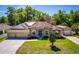 Single Gathering home with a three car garage, well maintained lawn, detached garage and solar panels at 475 Pitt St, Clermont, FL 34711