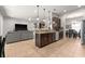 Spacious kitchen with stainless steel appliances, dark cabinetry, a breakfast bar, and easy access to the living room at 475 Pitt St, Clermont, FL 34711