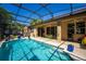 Relaxing screened-in pool area with outdoor seating and sunny patio at 475 Pitt St, Clermont, FL 34711