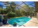 Beautiful screened-in pool with lush greenery, a peaceful retreat at 475 Pitt St, Clermont, FL 34711