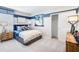 Well-lit bedroom with a comfortable bed, modern decor, and a spacious closet, designed for a or teenager at 4770 Cloister St, Kissimmee, FL 34758