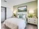 Comfortable bedroom with plush bedding, serene decor and decorative bedside table at 4770 Cloister St, Kissimmee, FL 34758