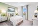 Comfortable bedroom with plush bedding, serene decor, bedside tables and outdoor views at 4770 Cloister St, Kissimmee, FL 34758