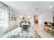 Dining room with modern table, decorative rug, contemporary lighting and large window at 4770 Cloister St, Kissimmee, FL 34758