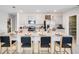 Open kitchen with island, modern appliances, seating and ample counter space at 4770 Cloister St, Kissimmee, FL 34758