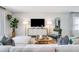 Cozy living room with a comfortable white sofa, modern decor, and a large television at 4770 Cloister St, Kissimmee, FL 34758
