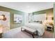 Serene main bedroom with a large bed, elegant decor, and soft, neutral colors at 4770 Cloister St, Kissimmee, FL 34758