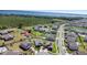 Aerial view of neighborhood, showcasing lake and houses at 5052 Blanchard Ct, St Cloud, FL 34772