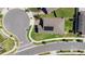 Aerial view of neighborhood home featuring paved driveway and solar panels at 5052 Blanchard Ct, St Cloud, FL 34772