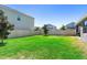 Spacious and well-maintained back yard enclosed by a white vinyl fence at 5052 Blanchard Ct, St Cloud, FL 34772