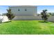 Spacious backyard with lush green grass and a white privacy fence at 5052 Blanchard Ct, St Cloud, FL 34772