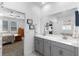 Bathroom featuring dual sinks, a large mirror, and modern fixtures at 5052 Blanchard Ct, St Cloud, FL 34772