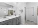 Modern bathroom with a double sink vanity and ample lighting at 5052 Blanchard Ct, St Cloud, FL 34772
