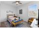 Bright bedroom featuring a window and comfortable furniture on top of a patterned rug at 5052 Blanchard Ct, St Cloud, FL 34772