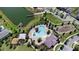 Aerial view of the community pool, lake, and playground area at 5052 Blanchard Ct, St Cloud, FL 34772