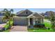 Charming single-story home with a well-manicured front yard at 5052 Blanchard Ct, St Cloud, FL 34772