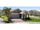 Attractive single-Gathering home with a landscaped front yard and covered entry at 5052 Blanchard Ct, St Cloud, FL 34772