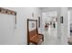 Inviting hallway featuring tiled flooring and a stylish wooden bench at 5052 Blanchard Ct, St Cloud, FL 34772