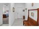 Inviting hallway featuring tiled flooring and a stylish wooden bench near the entry at 5052 Blanchard Ct, St Cloud, FL 34772