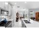 Well-lit kitchen showcasing sleek countertops, stainless steel appliances, and an open-concept design at 5052 Blanchard Ct, St Cloud, FL 34772