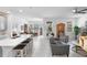 Bright open-plan living area seamlessly connects the kitchen, dining, and living spaces at 5052 Blanchard Ct, St Cloud, FL 34772