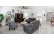 Bright living room features modern furniture, stylish decor, ceiling fan and tile flooring at 5052 Blanchard Ct, St Cloud, FL 34772
