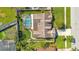 Aerial view of a home highlighting a screened pool, spacious yard, and well-maintained landscaping at 5263 Jade Cir, Belle Isle, FL 32812