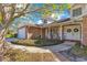 Charming brick home with a double-door entryway, complete with decorative wreaths and a cozy porch at 5263 Jade Cir, Belle Isle, FL 32812