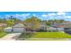 Charming home with manicured lawn, brick accents, and a welcoming porch creating curb appeal at 5263 Jade Cir, Belle Isle, FL 32812