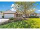 Charming single-Gathering home with brick accents, lush landscaping, and a welcoming front porch at 5263 Jade Cir, Belle Isle, FL 32812