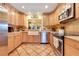 Bright kitchen with tile flooring, stainless steel appliances, a farmhouse sink and stylish tile backsplash at 5263 Jade Cir, Belle Isle, FL 32812
