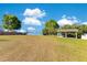 Expansive grass lot with gazebo overlooking the lake, ideal for outdoor activities at 5263 Jade Cir, Belle Isle, FL 32812
