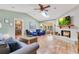 Spacious living room boasting a fireplace, tile flooring, and seamless access to the outdoor patio at 5263 Jade Cir, Belle Isle, FL 32812