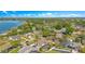 Panoramic aerial view of lakeside residential community featuring tree-lined streets and manicured lawns at 5263 Jade Cir, Belle Isle, FL 32812